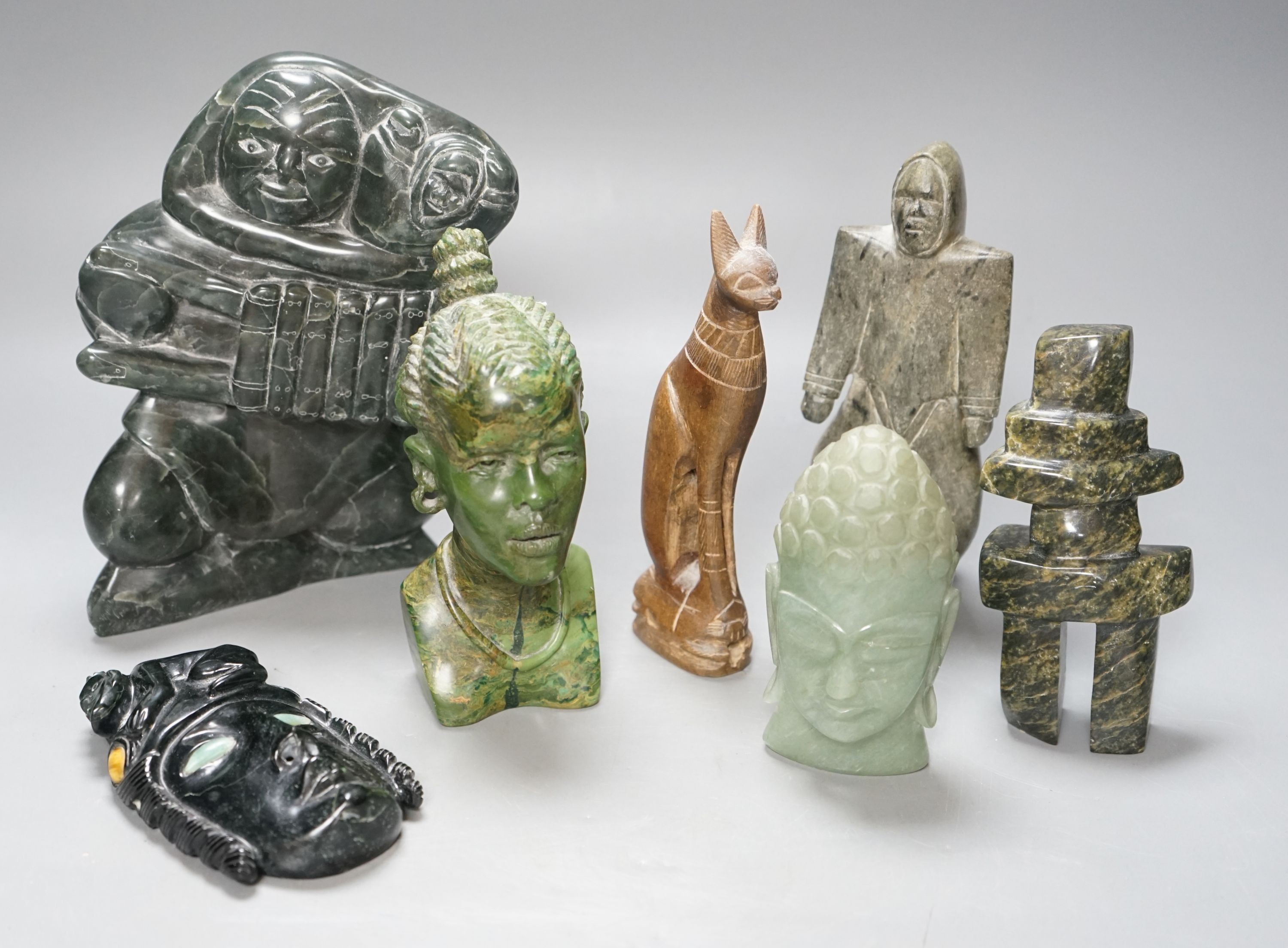 A group of Inuit and African stone carvings 19cm